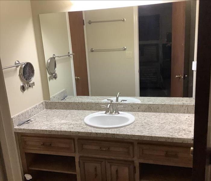 Restroom built back with new sink and wall Mirror