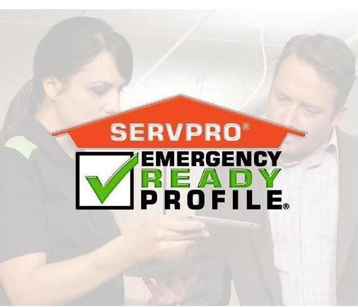 SERVPRO Technician Showing a business owner our mobile ERP App